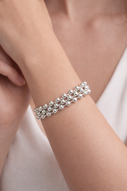 Bracelete aberto de prata 925 com design orgânico entrelaçado e esferas polidas